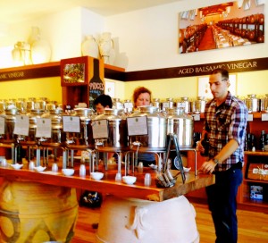 Nate Bradley assisting a customer at Amphora Nueva's tasting bar of the newest olive oils